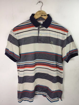 Lacoste polo azul marino y blanco a rayas M